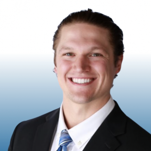 Equity team member in a dark suit with a blue striped tie, smiling confidently